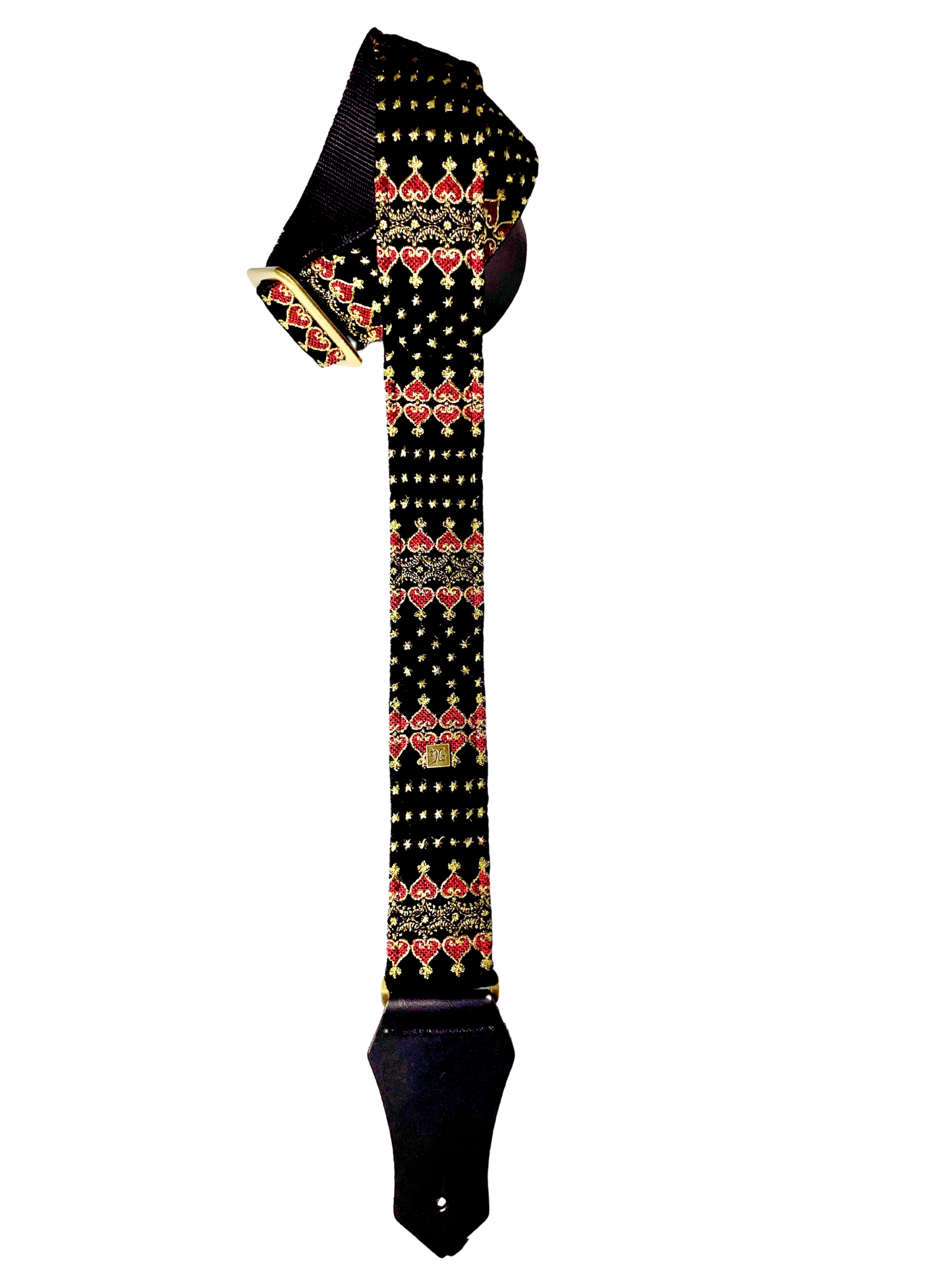 The Indochine guitar and bass strap in black with a golden and red pattern.