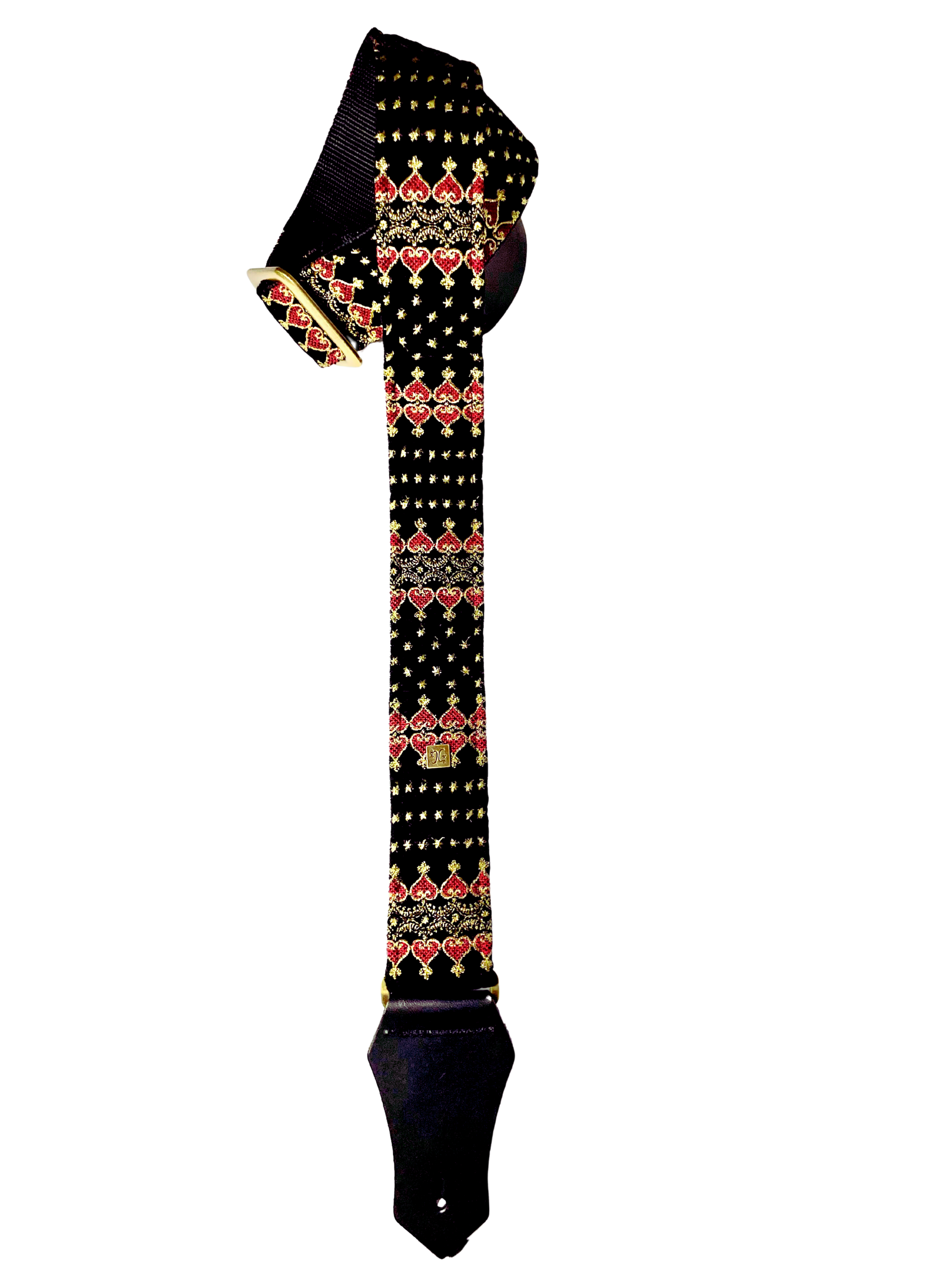 The Indochine guitar and bass strap in black with a golden and red pattern.